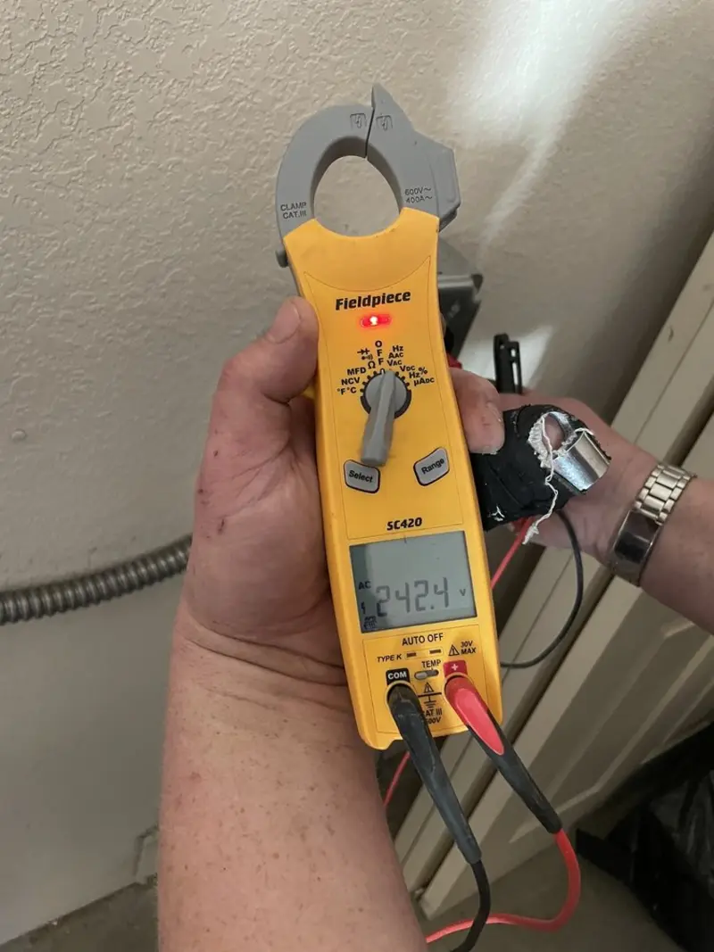 Voltage testing with clamp meter during Ceiling Fan Installation in Lower Chanceford
